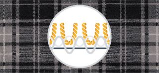 Cross section of yarns in a woven carpet on a black and white checked carpet background